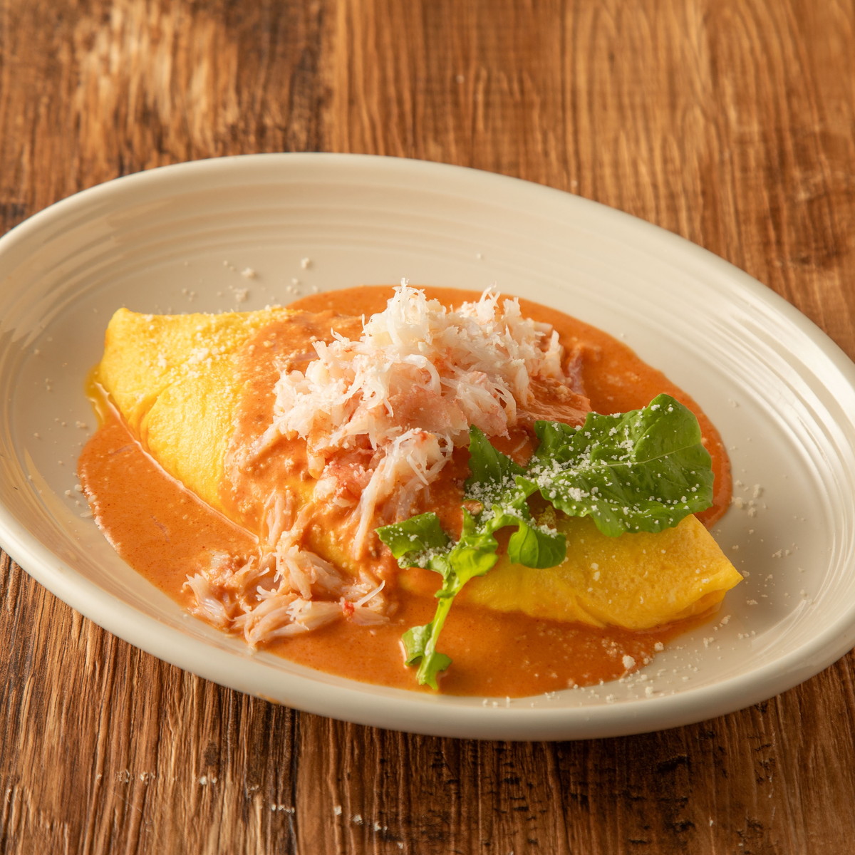 Snow Crab and Cheese Omelet with Tomato Cream Sauce